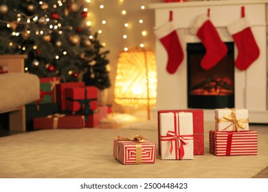 Stylish room with fireplace, Christmas tree and gift boxes - Powered by Shutterstock