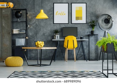 Stylish Room With Gray Textured Wall, Desk, Posters And Computer