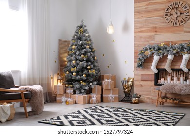 Stylish Room Interior With Beautiful Christmas Tree And Decorative Fireplace