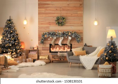 Stylish Room Interior With Beautiful Christmas Tree And Decorative Fireplace