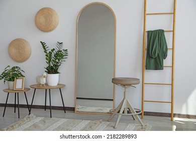 Stylish Room Interior With Leaning Floor Mirror