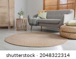 Stylish rug on floor in living room