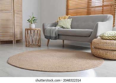 Stylish rug on floor in living room - Shutterstock ID 2048322314