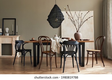 Stylish Rustic Interior Of Dining Room With Walnut Wooden Table, Retro Chairs, Decoration, Fireplace, Dried Flower, Candlestick Mock Up Picture Frame And Carpet In Minimalist Home Decor. Template.