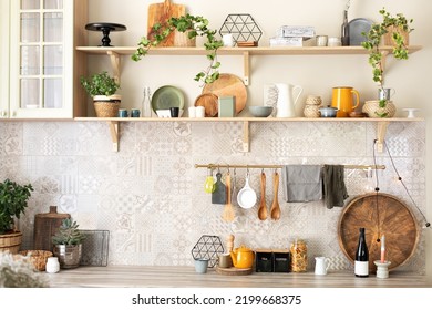 Stylish scandi cuisine interior decor. Ceramic plates, dishes, utensils and cozy decor on wooden shelfs. Kitchen wooden shelves with various ceramic jars and cookware. Open shelves in the kitchen.  - Shutterstock ID 2199668375