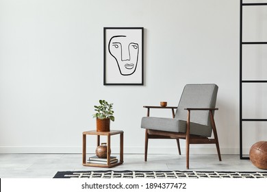 Stylish Scandinavian Composition Of Living Room With Design Armchair, Black Mock Up Poster Frame, Plant, Wooden Stool, Book, Decoration, Loft Wall And Personal Accessories In Modern Home Decor.