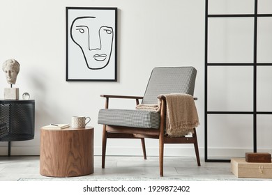 Stylish Scandinavian Composition Of Living Room With Design Armchair, Black Mock Up Poster Frame, Commode, Wooden Stool, Book, Decoration, Loft Wall And Personal Accessories In Modern Home Decor.