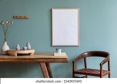 Stylish scandinavian dining room interior with mock up poster frame, wooden table, furniture, cupof coffee, flowers , cement fruits and elegant accessories. Ready to use. Template. Modern home decor. - Powered by Shutterstock