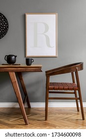 Stylish scandinavian dining room interior with mock up poster frame, wooden table, furniture, tea pot , decoration and elegant accessories in modern home decor.