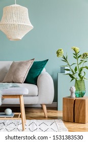 Stylish Scandinavian Interior Design Of Living Room With Gray Sofa, Wooden Cube, Cotton  Lamp, Flowers In Vase, Colorful Pillows And Elegant Accessories. Abstract Background Wall, Modern Home Decor.