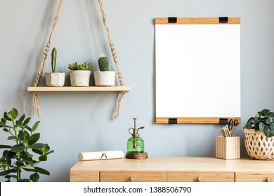 Stylish Scandinavian Interior With Wooden Desk, Mock Up Poster Frame, Elegant Accessories, Hanging Wooden Shelf And A Lot Of Beautiful Cacti In Cement Pots. Modern Home Decor. Gray Background Wall. 