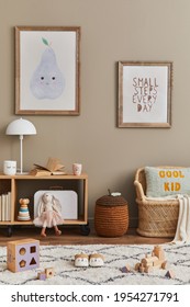 Stylish scandinavian kid room interior with toys, teddy bear, plush animal toys, rattan sofa, furniture, decoration and child accessories. Brown wooden mock up poster frames on the wall. Template - Shutterstock ID 1954271791