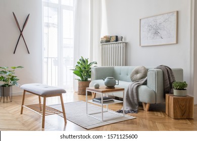 Stylish scandinavian living room with design mint sofa, furnitures, mock up poster map, plants and elegant personal accessories. Modern home decor. Bright and sunny room. Template Ready to use. 