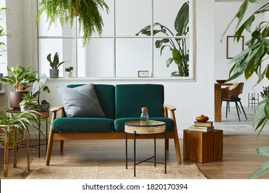 Stylish Scandinavian Living Room Interior With Green Velvet Sofa, Coffee Table, Carpet, Plants, Furniture, Elegant Accessories In Modern Home Decor. Template.