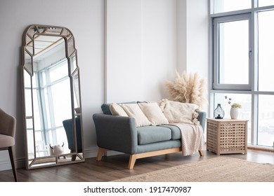 Stylish Scandinavian modern white cozy eco interior in minimalist style.Modern home decor. Open space.