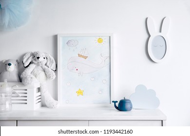 Stylish Scandinavian Newborn Baby Room With Toys, Rabbit, Small Mirror And Cloud. Modern Interior With Mock Up Photo Frame.