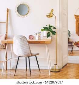 Stylish Scanidnavian Interior Of Apartment With Wooden Desk, Gray Chair, Design Accessories And Furnitures, Big Yellow Macrame On The White Wall. Design Home Decor Of Sitting Room. Warm And Cozy. 