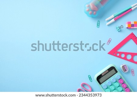 Stylish school supplies on pastel blue background. Flat lay, top view. Back to school concept.