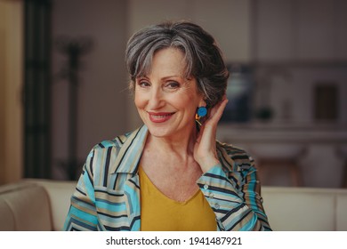 Stylish Senior Woman Showing New Earrings Or New Haircut Smiling Looking At The Camera