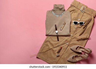 Stylish shoes, new clothes and accessories on pink background, flat lay. Space for text