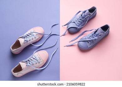 Stylish Shoes With Untied Laces On Color Background