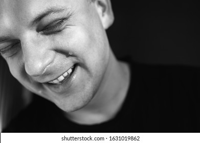 Stylish shot of a young man crying with laughter