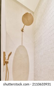 Stylish Shower Room With Gold Plated Faucet In An Elegant Bathroom