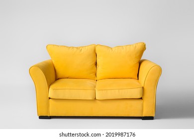 Stylish sofa on light background