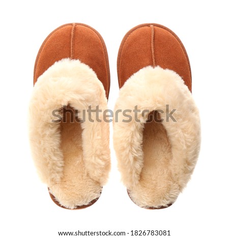 Stylish soft slippers on white background, top view