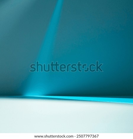 Stylish square background with blue light and shadows on wall and table. Mock up with blurry spotlight for winter presentation, branding products, cosmetics and food.
