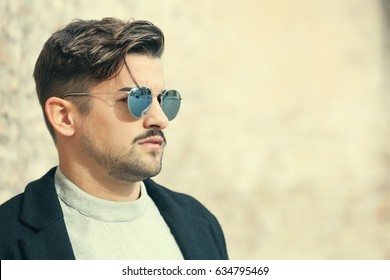 Stylish Straight Hair. Man Profile With Sunglasses. A Handsome Young Man Wearing Sunglasses. Close Portrait With Face In Profile. Outdoors.