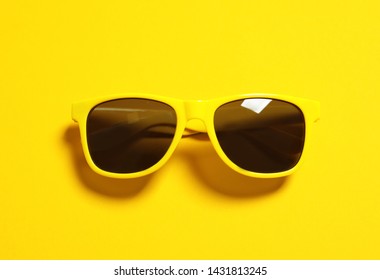 Stylish sunglasses on color background, top view. Beach accessories - Powered by Shutterstock