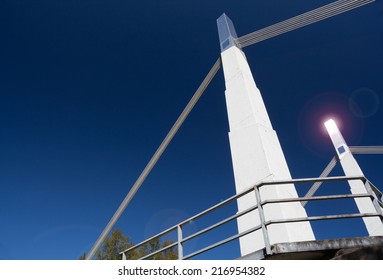 The Stylish Suspension Bridge Over The Green River Near Black Diamond, Washington, USA, With Lens Flare That Occurred When Morning Sun Bounced Off The Steel-clad Top Of The Suspension Column.