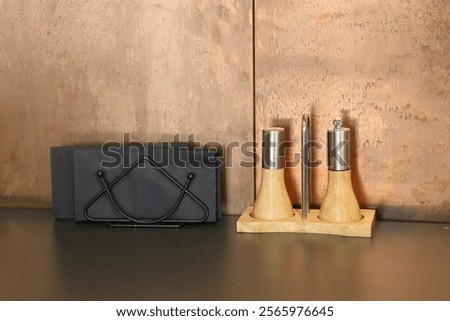 Stylish Table Set with Salt and Pepper Shakers and a Napkin Holder for your enjoyment