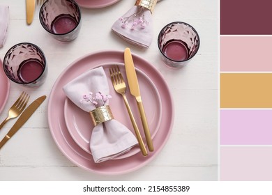 Stylish table setting with flowers on white wooden background. Different color patterns