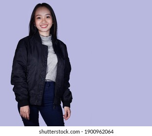 Stylish Teenage Girl Wearing A Black Bomber Jacket