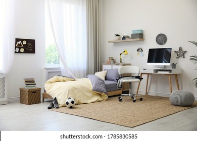 Stylish teenager's room interior with comfortable bed and workplace - Shutterstock ID 1785830585