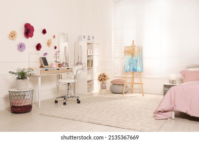 Stylish Teenager's Room Interior With Computer, Comfortable Bed And Painting Easel