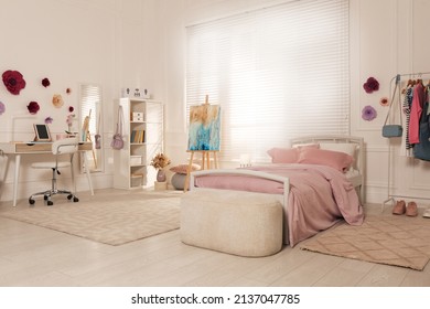 Stylish Teenager's Room Interior With Computer, Comfortable Bed And Painting Easel