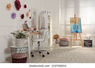 Stylish Teenager's Room Interior With Computer And Painting Easel