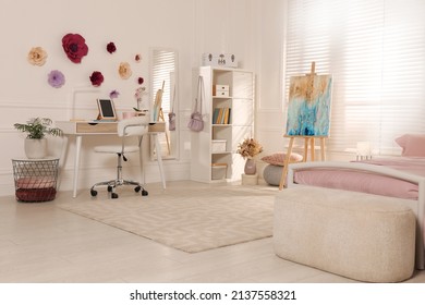 Stylish Teenager's Room Interior With Computer, Comfortable Bed And Painting Easel