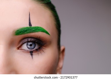 stylish trendy trendy halloween makeup. Eye close-up macro. Clown costume for a masquerade. The concept of emotions of anger, envy, madness. Green background place for banner text. Creepy scary - Shutterstock ID 2172901377