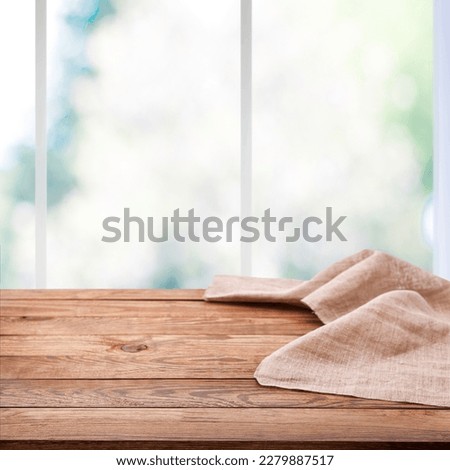 Stylish and Versatile Rustic chic: Use This Wooden Table and Napkin for Any Marketing Material. Wrinkled tablecloth front view mockup perspective. Sunny day background.