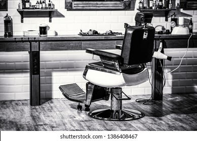 Stylish vintage barber chair. Professional hairstylist in barbershop interior. Barbershop armchair, modern hairdresser and hair salon, barber shop for men. Barber shop chair. Black and white.