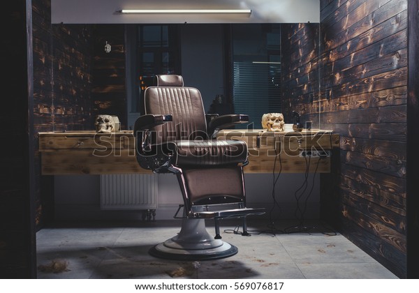 Stylish Vintage Barber Chair In Wooden Interior.\
Barbershop Theme