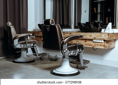 Stylish Vintage Barber Chairs In Wooden Interior. Barbershop Theme