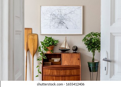 Stylish And Vintage Interior Design Of Living Room With Wooden Retro Commode, Plants, Ships, Paddle, Map And Elegant Personal Accessories. Mock Up Poster Frame On The Wall. Template. Home Decor.