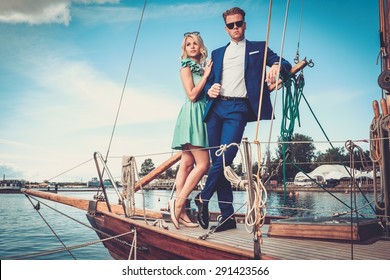 Stylish Wealthy Couple On A Luxury Yacht 