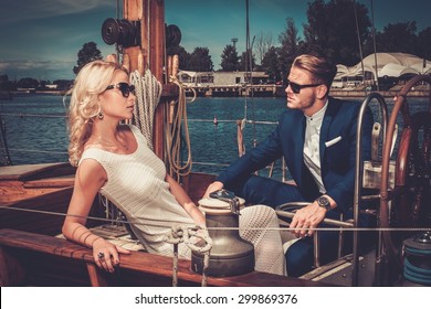 Stylish Wealthy Couple On A Luxury Yacht 