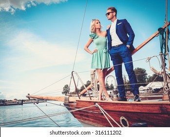 Stylish Wealthy Couple On A Luxury Yacht 